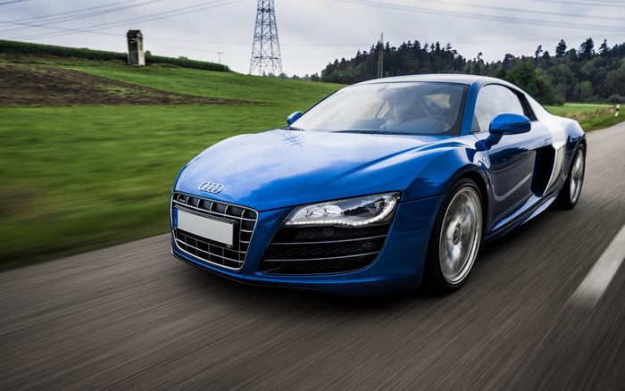Blue Audi R8 Sports Car Driving on Road