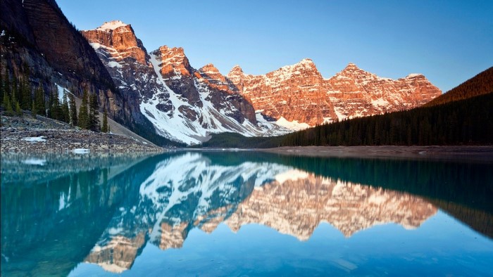 Moraine Lake with snow-capped mountains and reflection