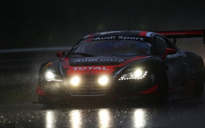 Audi R8 LMS race car driving in the rain