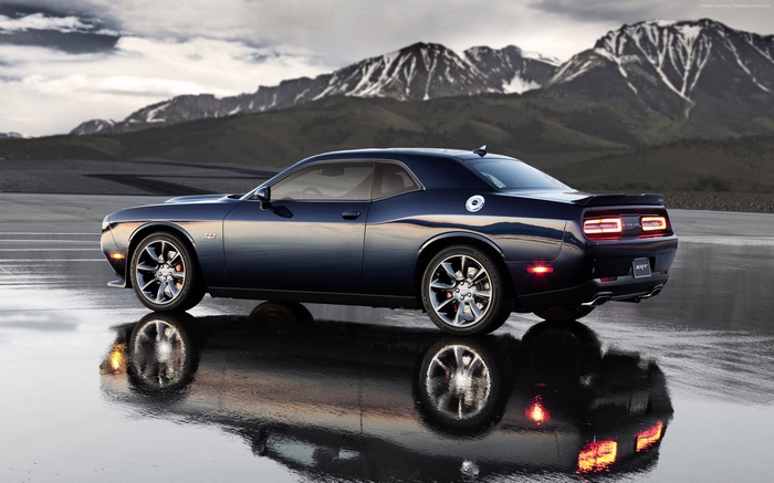 Dodge Challenger SRT Hellcat on Wet Road with Mountains