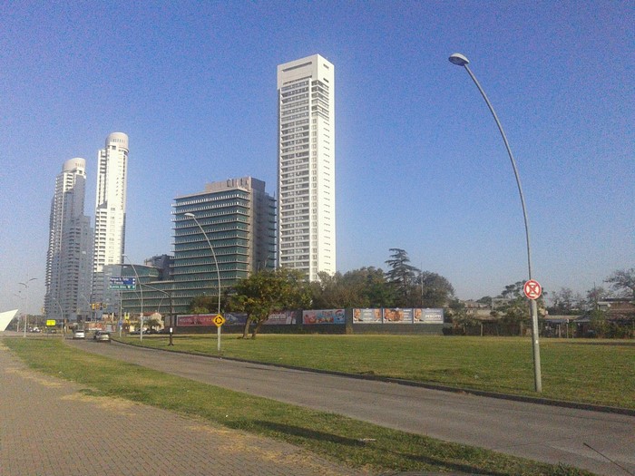 Modern skyscrapers and buildings along a road in a city