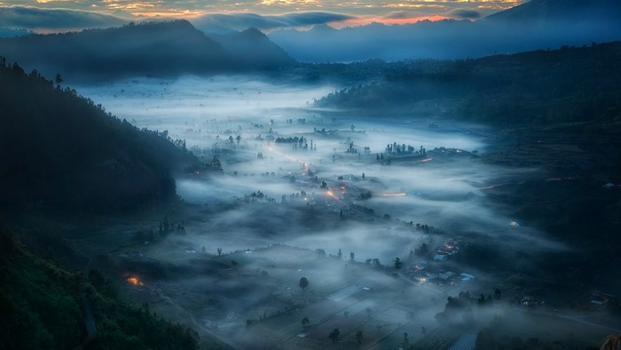 Misty valley village at sunrise in Bali, Indonesia