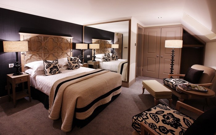 Hotel bedroom with a large bed and seating area