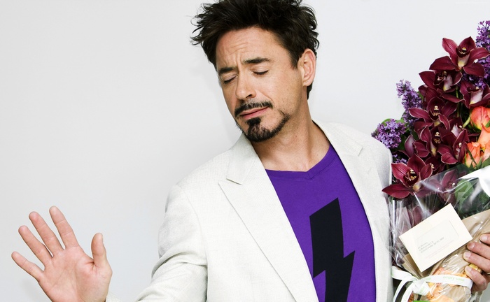 Robert Downey Jr. holding a bouquet of flowers