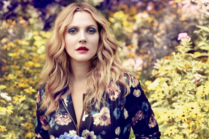 Drew Barrymore in a floral jacket with blue eyeshadow