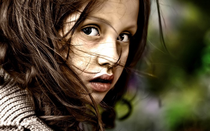 Close up portrait of a young girl with brown hair