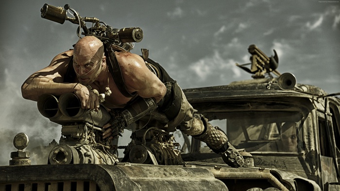 Max from Mad Max: Fury Road on a vehicle