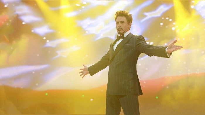 Tony Stark in a suit on stage