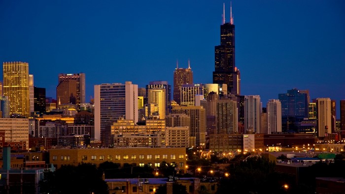 Chicago skyline at dusk with illuminated skyscrapers