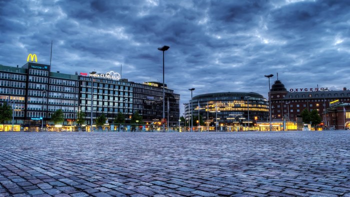 Hakaniemen tori square at dusk with buildings and clouds