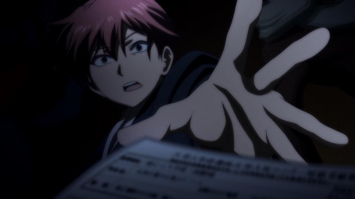 Yuzuru Otonashi reaching for a document in darkness