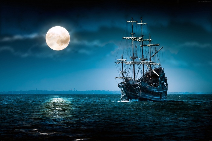 Pirate ship sailing under a full moon at night