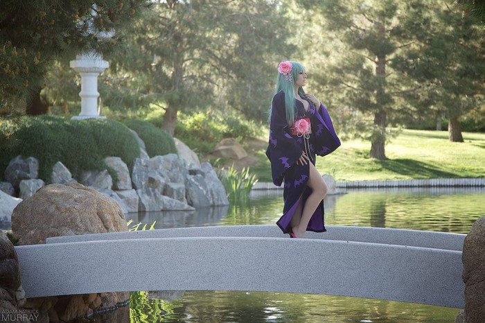 Jessica Nigri in a kimono on a bridge in a Japanese garden
