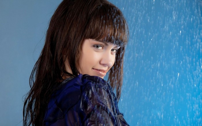 Woman in blue shirt in the rain