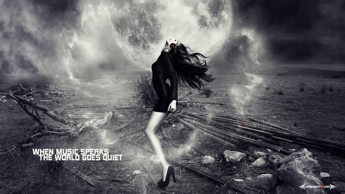 Woman in black dress under a large moon