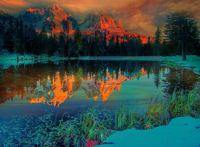 Mountain range reflected in a lake at sunset