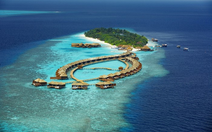 Overwater bungalows in a tropical island resort lagoon