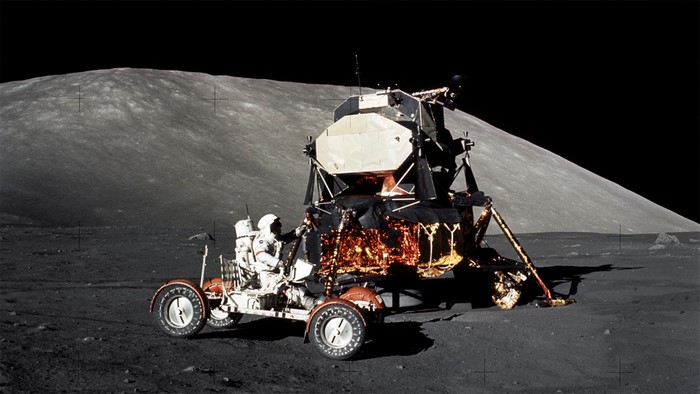 Astronaut and Lunar Rover next to Lunar Module on the Moon