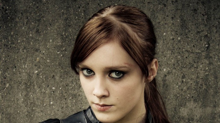 Close-up portrait of a young woman with brown hair