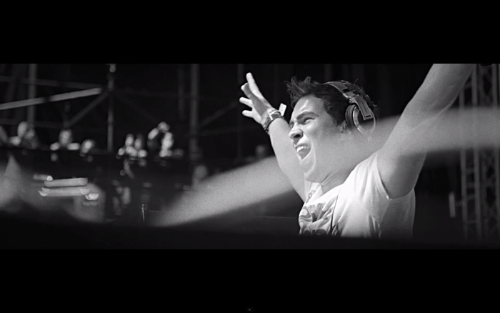 DJ Hardwell performing on stage with headphones