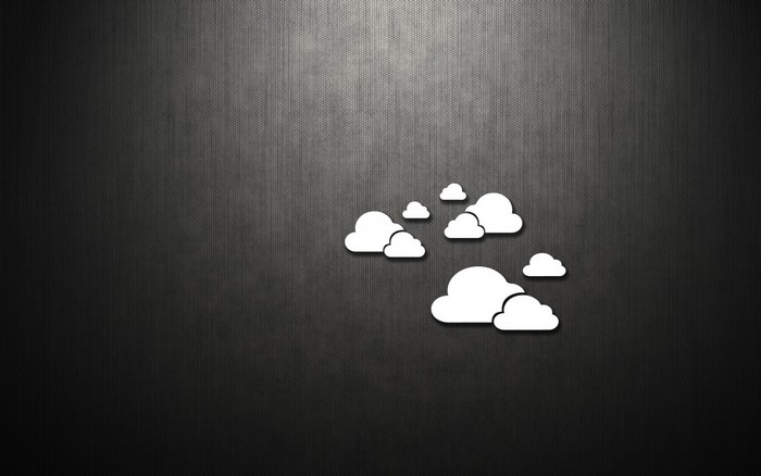 White clouds on a dark textured background
