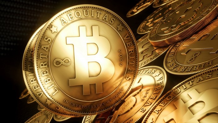 Gold Bitcoin coins with inscriptions