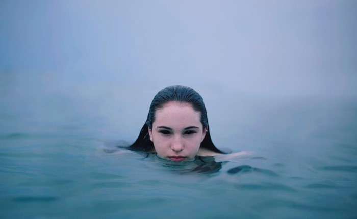 Woman with dark eyes in the sea