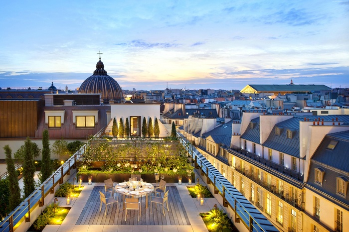Rooftop terrace cafe in Paris at twilight