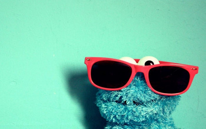 Cookie Monster wearing red sunglasses