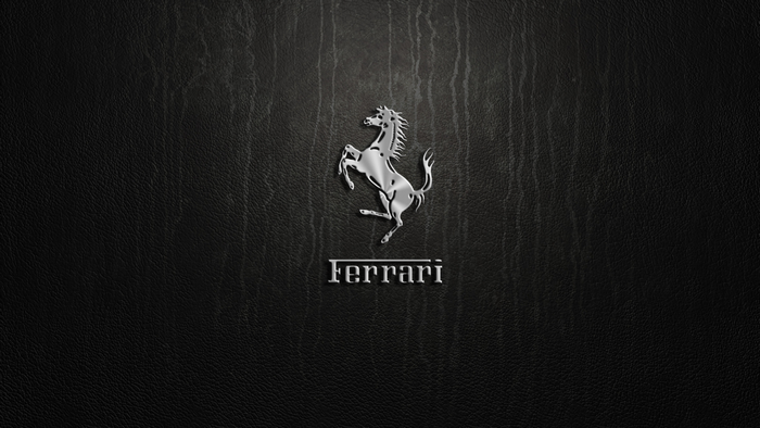 Ferrari logo on black textured background