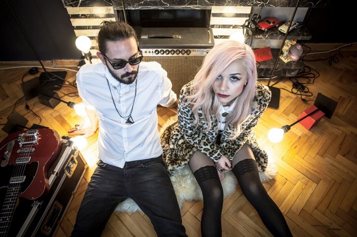 Couple with guitar and amplifier