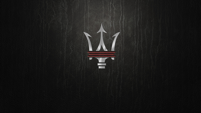 Maserati logo on black textured background