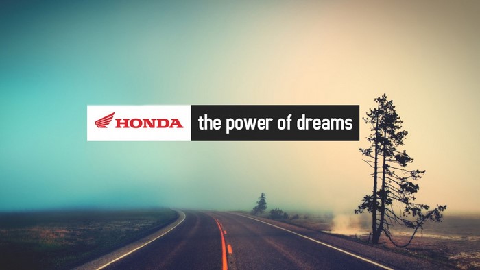 Honda the power of dreams logo on a foggy road