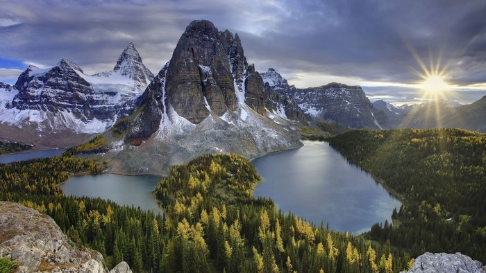 Mountainous landscape with lakes and sunburst