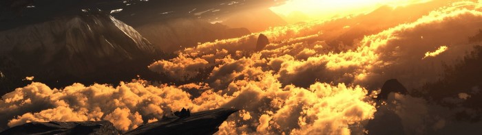 Sunlight over clouds and mountains