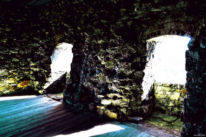 Sunlight through windows in an old stone building