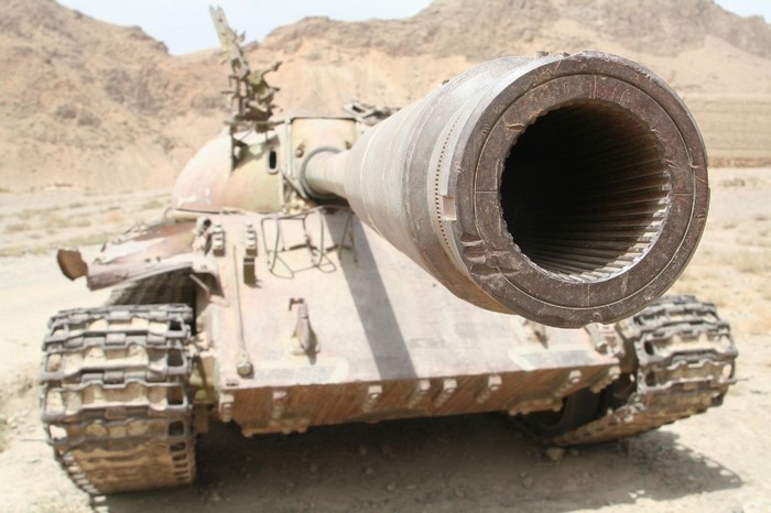 T-55 tank with large cannon in desert landscape