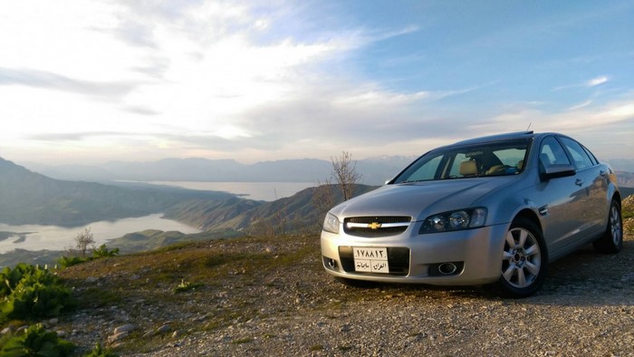 Silver Chevrolet Lumina Sedan on a Mountain Road