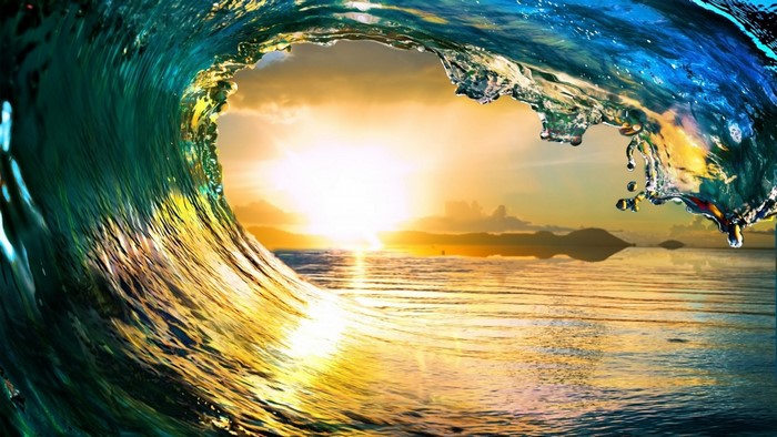 Wave crashing at sunset over the ocean