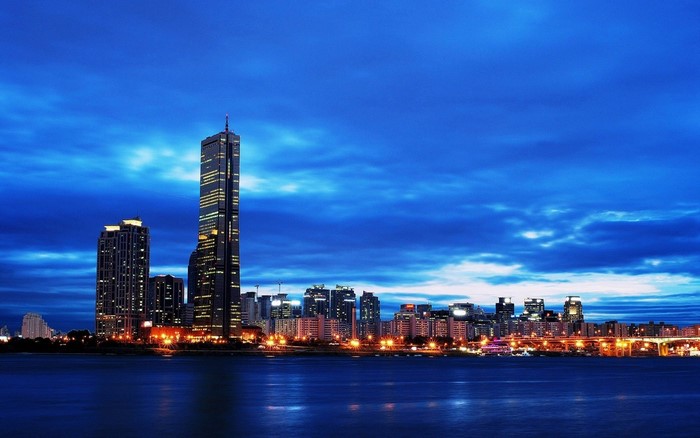 Seoul cityscape at dusk with skyscrapers and river