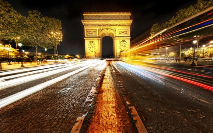 Arc de Triomphe at night with light trails