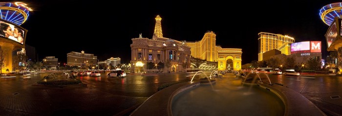 Las Vegas Strip at night with Paris Las Vegas and Bellagio fountains