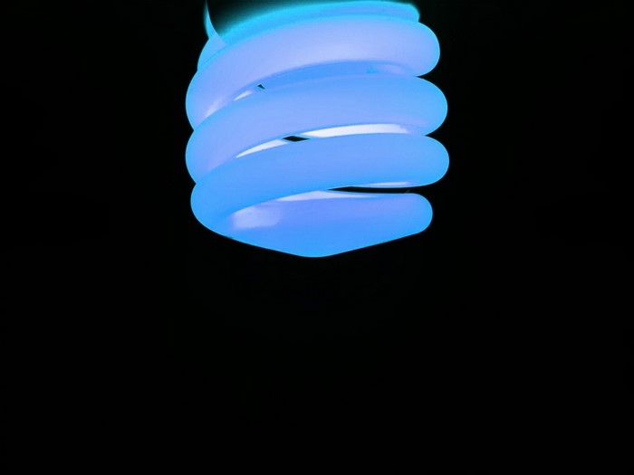 Close-up of a blue spiral light bulb