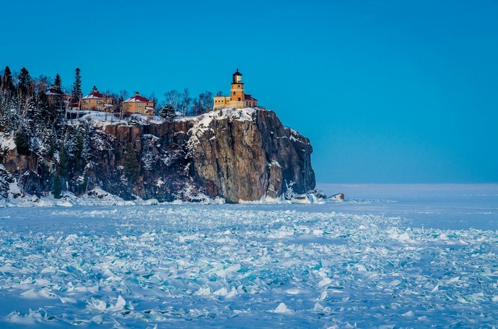 Split Rock Lighthouse on a snowy cliff overlooking Lake Superior