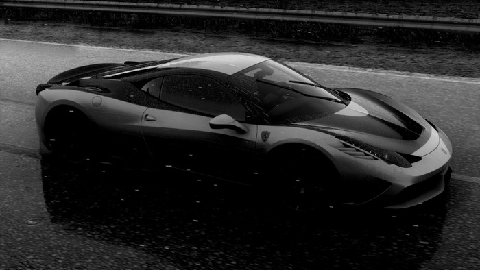 Monochrome Ferrari 458 driving in the rain