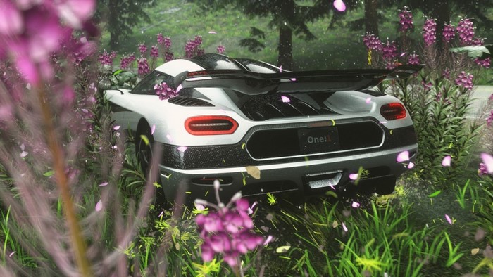 Koenigsegg One:1 sports car in a forest setting