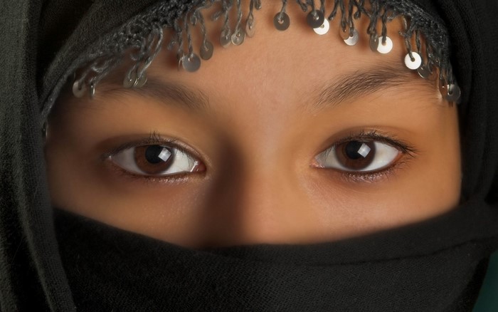 Close up of a girl's eyes wearing a black hijab