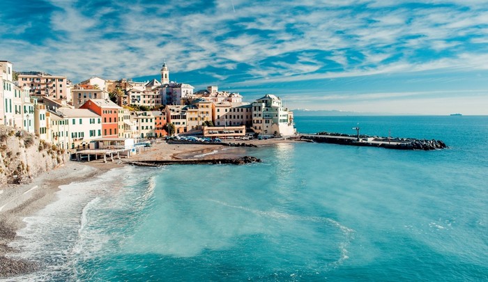 Coastal town with colorful buildings and a pier on the sea