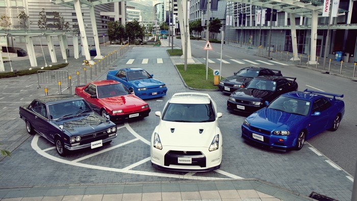 Collection of Nissan Skyline GT-R cars in a cityscape