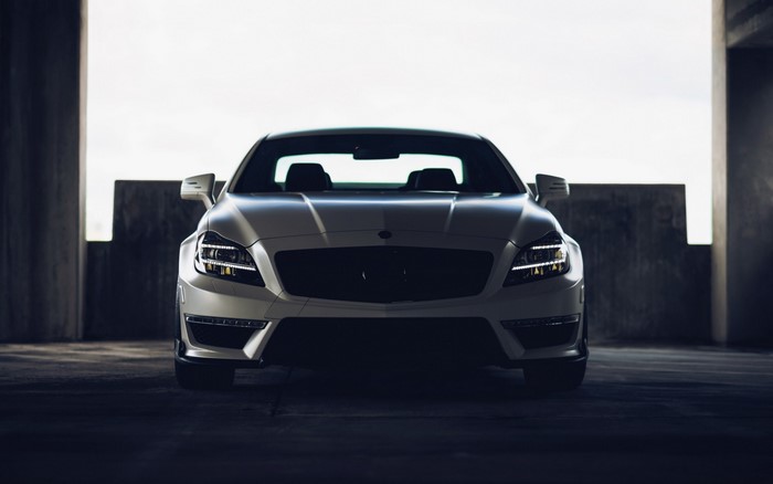 White Mercedes-Benz CLS 63 AMG parked in a garage